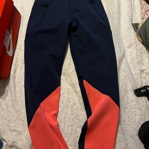 Sweaty Betty  and orange n navy blue leggings